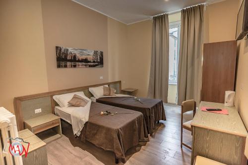 Postel nebo postele na pokoji v ubytování Hotel Moderno