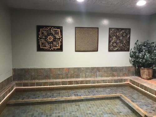a waiting room with three pictures on the wall at Riverside Hot Springs Inn & Spa - Adults Only in Lava Hot Springs