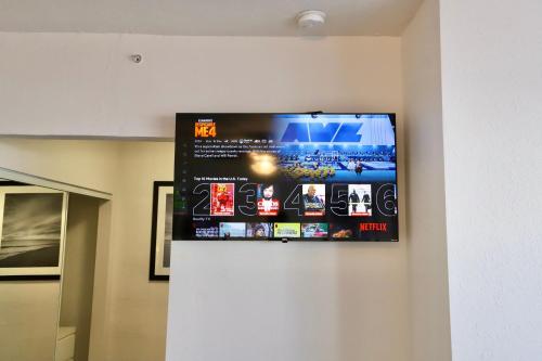 a flat screen tv hanging on a wall at South of Fifth Studio Steps to Beach on Ocean Drive in Miami Beach