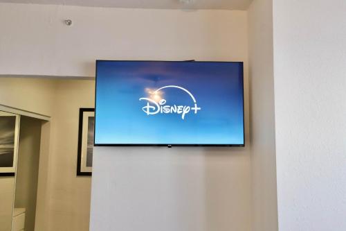 a flat screen tv hanging on a wall at South of Fifth Studio Steps to Beach on Ocean Drive in Miami Beach