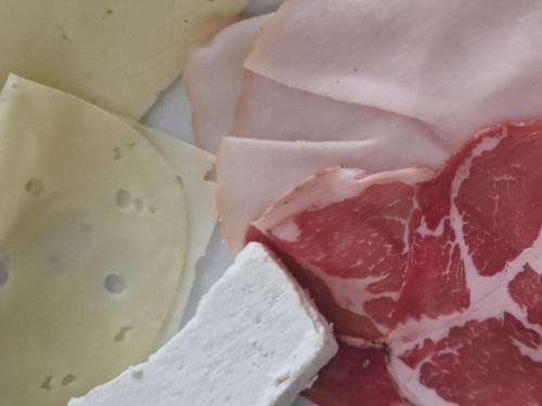 a group of different types of cheeses on a plate at NeroBianco B&B Sorrento in Sorrento