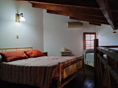 a bedroom with a large bed in a house at Aires serranos in Tandil