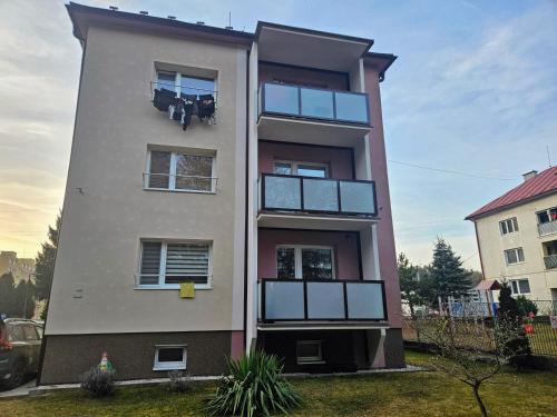 a tall building with windows on the side of it at MK Apartment Hron in Podbrezová