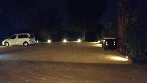 a car parked in a parking lot at night at Hotel Ristorante alla Campagna in San Giovanni Lupatoto
