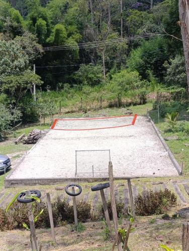 a skate park with a skateboard ramp in a field at Refúgio Atlântico in Mogi das Cruzes