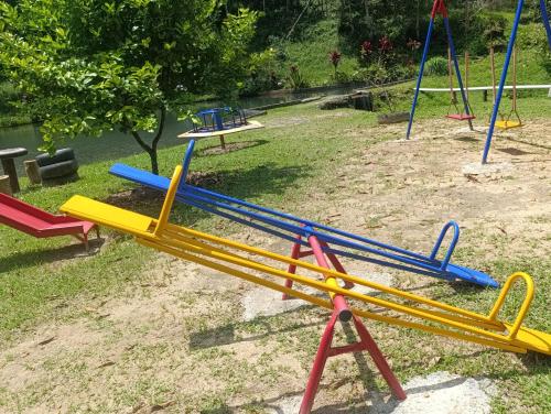 a pile of colorful playground equipment in a yard at Refúgio Atlântico in Mogi das Cruzes