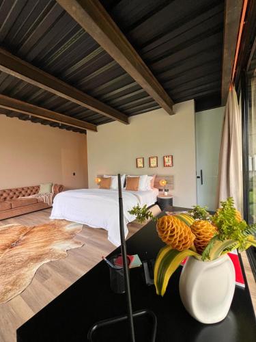 a bedroom with a bed and a table with fruit on it at 1 Relax, luxury room, everything you need in Salento