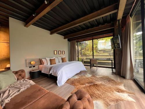 a bedroom with a bed and a large window at 1 Relax, luxury room, everything you need in Salento