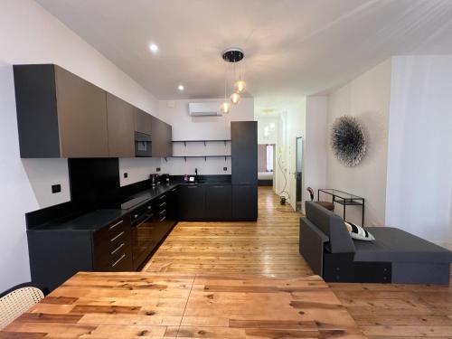 Kuchyň nebo kuchyňský kout v ubytování Le Filatier - Centre - Luxe - Balcon - Climatisation