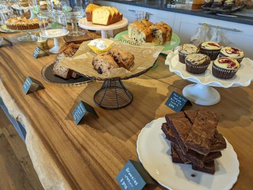 a table topped with different types of cakes and pastries at Kaeda Terrace - Vacation STAY 69516v in Miyazaki