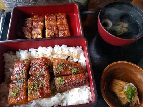 a red container of food with rice and meat at Kaeda Terrace - Vacation STAY 69516v in Miyazaki