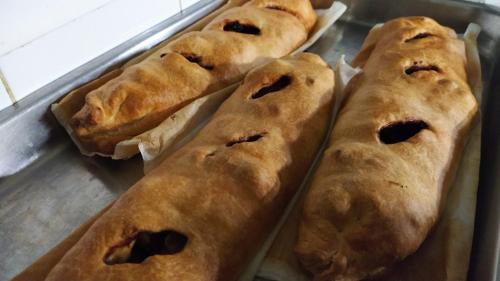 a group of five pastries on a baking sheet at Hotel Ristorante alla Campagna in San Giovanni Lupatoto