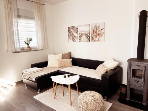 a living room with a couch and a stove at Casa Bruno in Vodnjan