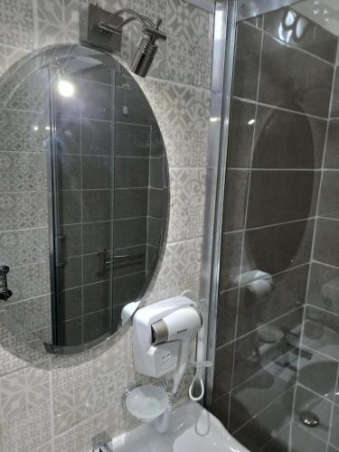 a bathroom with a shower and a toilet and a mirror at Le spighe dei papi in Anagni