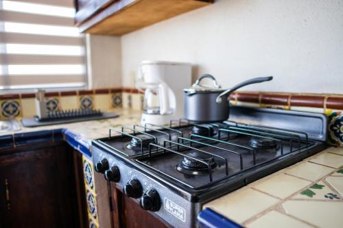 Una cocina o cocineta en Depas WAICURA'S