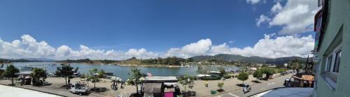 a view of a river with boats in the water at Hotel Portobelo Guatape in Guatapé