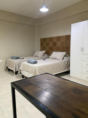 Ένα ή περισσότερα κρεβάτια σε δωμάτιο στο Mono ambiente en el centro 3