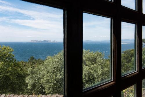 a view of the ocean from a window at LUXURY CELAVELLA GALICIA Hc in Baiona