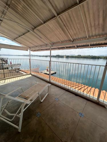 a room with a view of the water at Rancho Madu in Passos