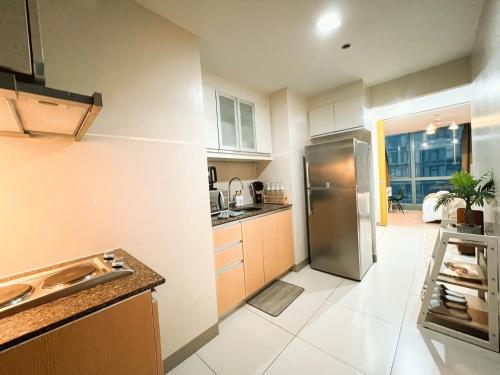 Kuchyň nebo kuchyňský kout v ubytování Prime 1br Condo Infront Grand Hyatt BGC #oursw20d1