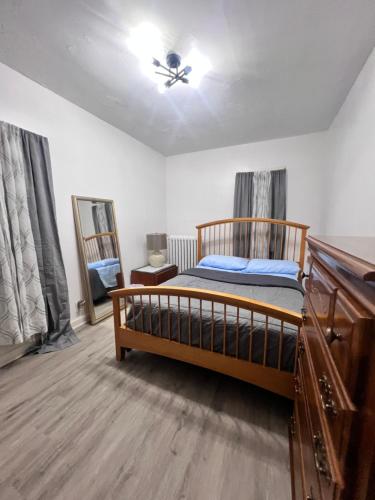 a bedroom with a bed and a ceiling fan at Preston Serenity Room With Shared Bath & Kitchen in Hartford