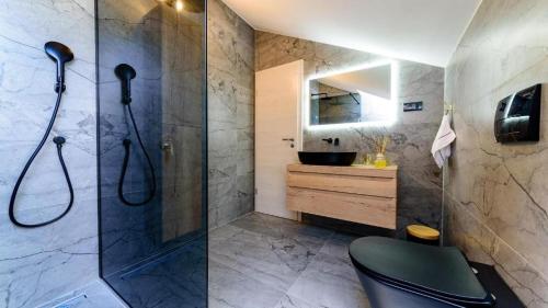 a bathroom with a shower and a sink at Apartments with WiFi Bol, Brac - 23862 in Bol
