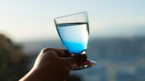 a hand holding a glass of water at Nishiizu Koyoi in Numazu