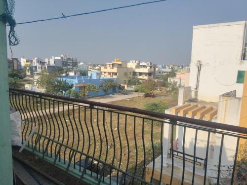 a balcony with a view of a city at Linga HomeStay in Kanchipuram