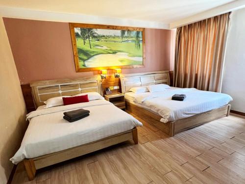 Postel nebo postele na pokoji v ubytování Hotel Balik Pulau