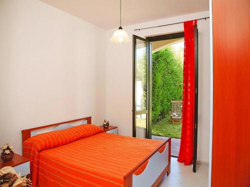 a bedroom with a bed and a sliding glass door at Residence in Sicily near Himera & Madonie Park in Buonfornello