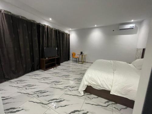 Madigane Residence Assinieにあるベッド