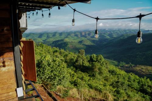 a room with a view of a mountain with lights at Monad Stopovers in Krola Dong (2)