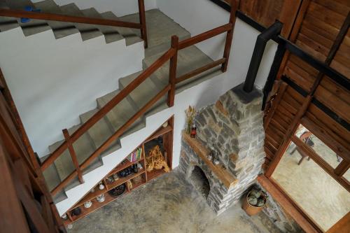 an overhead view of a staircase with a stone fireplace at Monad Stopovers in Krola Dong (2)