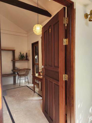 an open door to a room with a table at Prana Siargao Resort in General Luna
