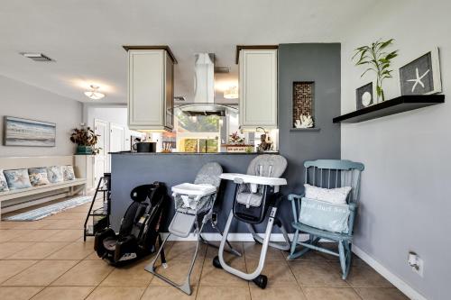 a kitchen with chairs and a table in a room at South Florida Spacious Oasis 4BR Retreat with 2 King Beds, Amazing Pool, near Beaches in Deerfield Beach