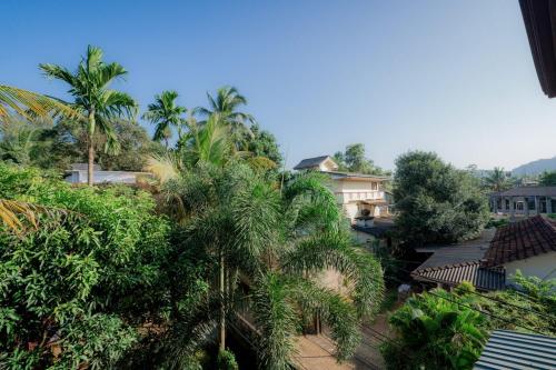an aerial view of a resort with palm trees at Suwani Pinnawala Homestay in Pinnawala