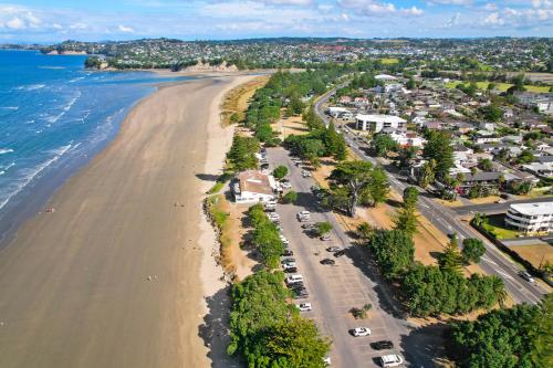 an aerial view of a beach with condos at Orewa Beachcomber in Orewa