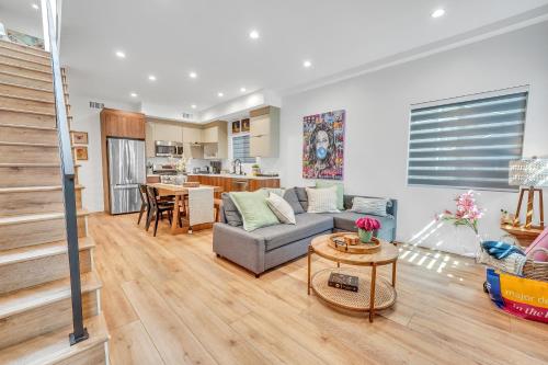 a living room with a couch and a table at Luxe Townhome Newly-Built in Sherman Oaks Community Hospital Heliport