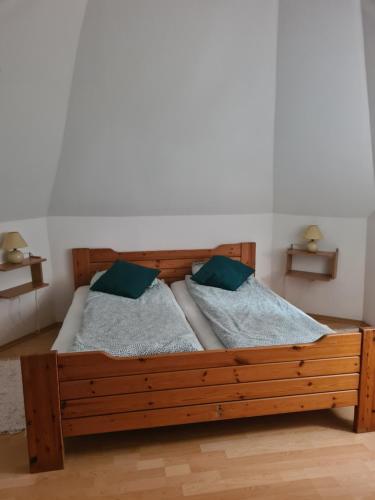 Postel nebo postele na pokoji v ubytování Elo Apartman