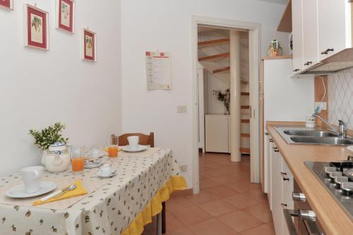 a kitchen with a table with a table cloth on it at La Tuga - Ravello Accommodation in Minori