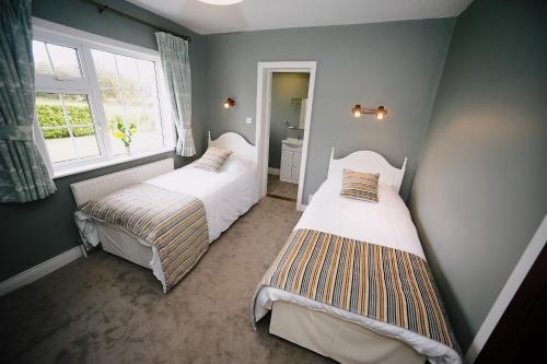 Postel nebo postele na pokoji v ubytování Wayside B&B V93XK6C