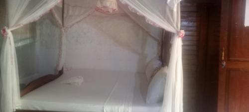 Katil atau katil-katil dalam bilik di Piscine bimoko