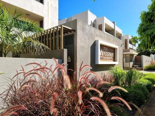 a building with a sign in front of it at Waterway Residence Apartment C2 groundfloor in Cascavelle