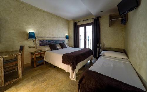 Katil atau katil-katil dalam bilik di Hotel Boutique Room Tarifa