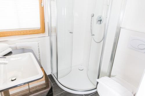 a bathroom with a shower and a sink at A Casa Residenz in Sölden