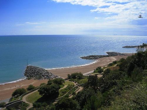 a view of a beach and the ocean at The Carlton Hotel in Folkestone