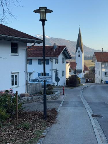 a street light on the side of a road at Alpinelounge -modern - spacious in Waltenhofen