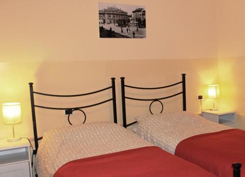 two beds sitting next to each other in a bedroom at Lepetit Milano in Milan