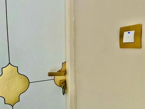 a door with a sticker on it next to a wall at Siyavar Palace in Orchha
