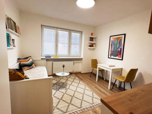 a living room with a couch and a table at Apartmán v centre in Nové Mesto nad Váhom